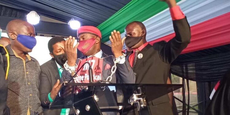 Swearing-in Suspended After NUP Councillors Jump On Podium Chanting “We are all prisoners of Museveni,”